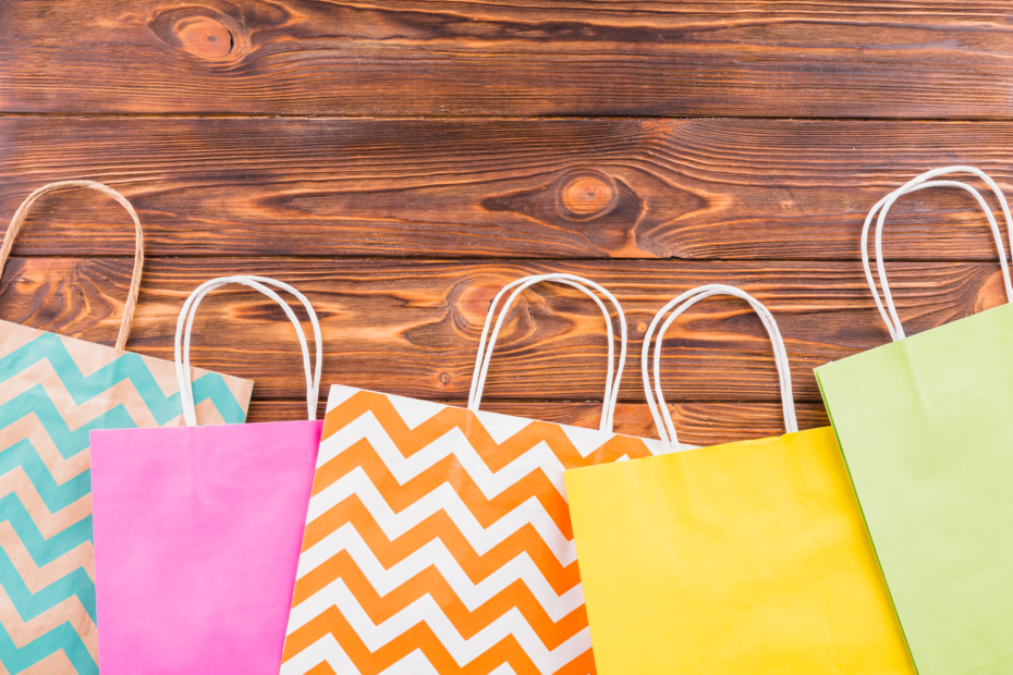 different-pattern-paper-bag-arranged-bottom-wooden-table