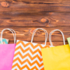 different-pattern-paper-bag-arranged-bottom-wooden-table